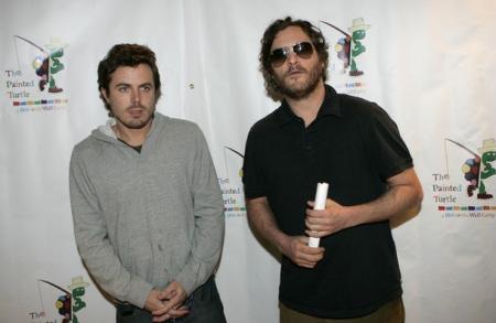 Casey Affleck stands next to Joaquin Phoenix at Davis Symphony Hall 