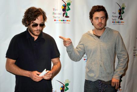 Casey Affleck is photographed pointing to Joaquin Phoenix at the Davis Symphony Hall