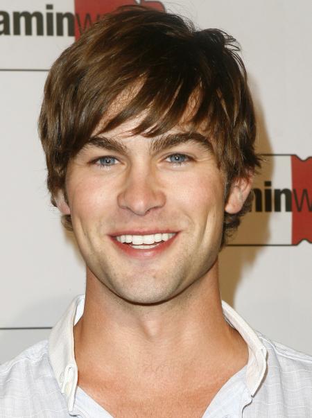Chase Crawford smiles for the camera at a Vitamin Water event