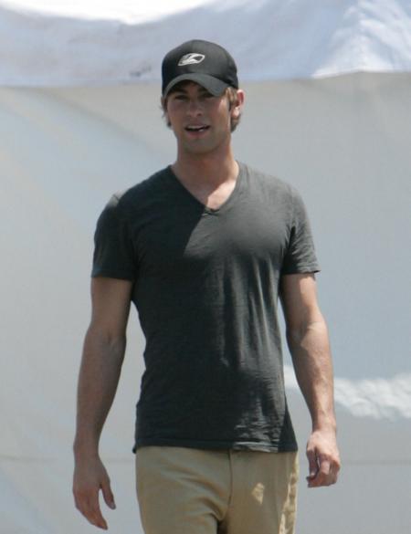 Chase Crawford shows off his muscles