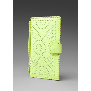 Stash your essentials for a night on the town in this adorable neon yellow clutch available from Revolve Clothing.