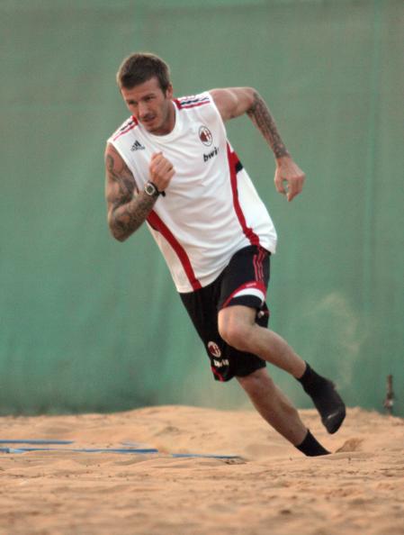 David Beckham runs in the sand