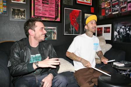 DJ AM and friend Travis Barker laugh it up
