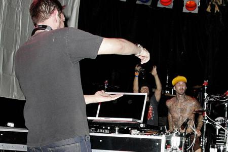 DJ AM on stage with drummer Travis Barker
