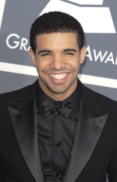Drake smiling at the 53rd Annual Grammy Awards