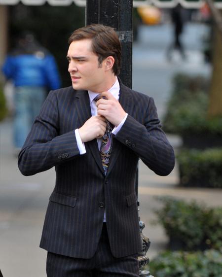 Ed Westwick adjusts his tie in Gossip Girls