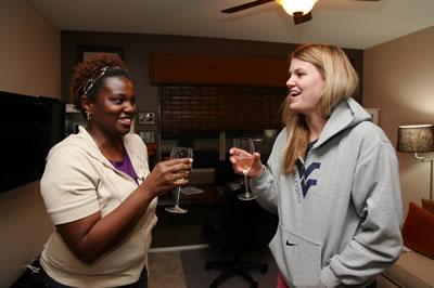 Kelly and Maria toast the finished room
