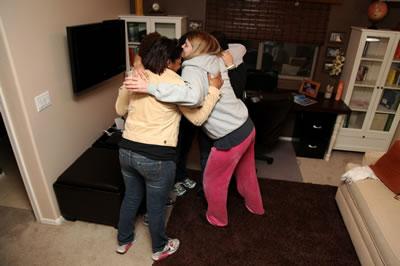 Kelly hugs the dseigners