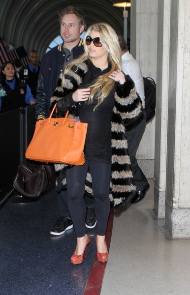 Jessica Simpson in orange stilettos