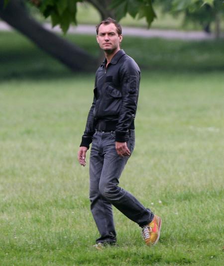 Jude Law walking in a park in London