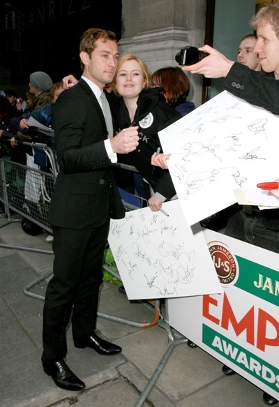 Jude Law talks with fans outside of 2010 The Empire Film Awards 