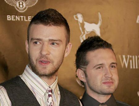 Justin Timberlake and Trace Ayala pose in front of a Bentley logo at Street Sexy