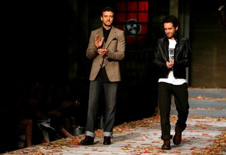Justin Timberlake and Trace Ayala stand on the William Rast runway
