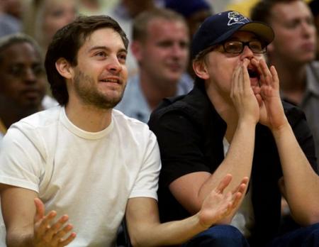 Leonardo DiCaprio and Tobey Maguire watch the Lakers play basketball
