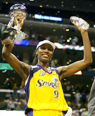 Lisa Leslie Holding Trophies