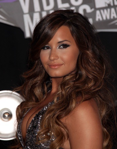 Demi Lovato's black smokey eyes and long wavy curls give her a dramatic look