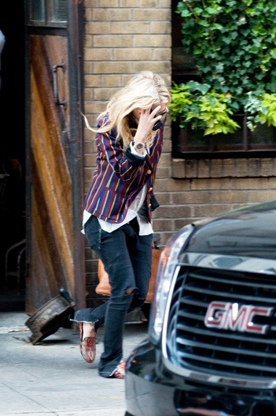 Mary-Kate Olsen tries to escape the paparazzi in NYC while out in Manhattan. Photo courtesy of Ivan Nikolov/WENN.