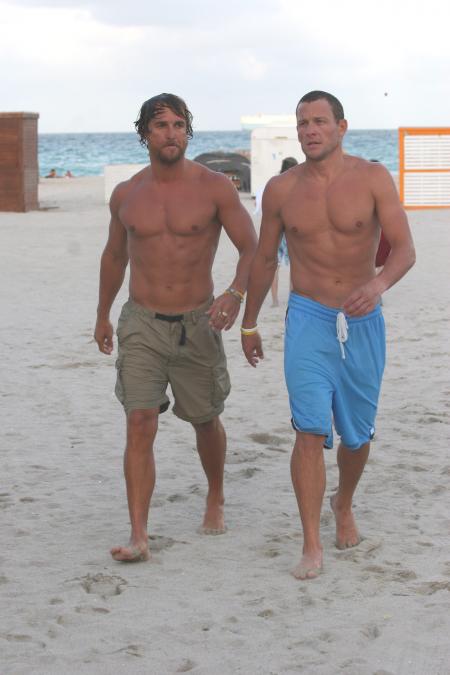 Matthew McConaughey and Lance Armstrong come in from the water