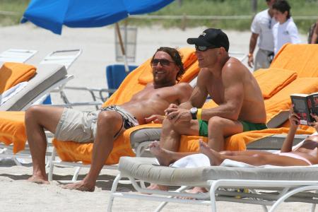 Matthew McConaughey and Lance Armstrong laugh at the beach