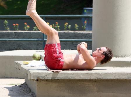 Matthew McConaughey works out on the beach in Rio