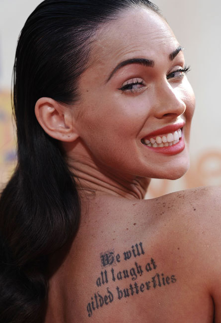 Megan Fox: Back tattoo quote. Actress Megan Fox has several tattoos, 