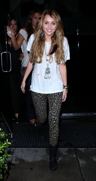 Miley Cyrus in animal print leggings