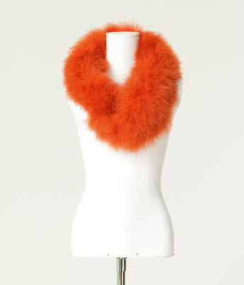 Channel your glamorous side with this orange fur stole from Zara.