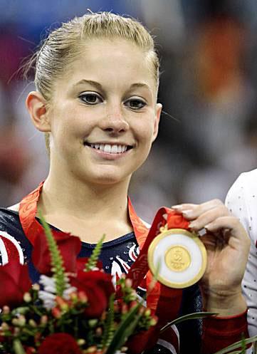 Shawn Johnson with her Gold Medal