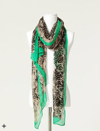 Dress up any outfit with this snake print scarf from Zara.
