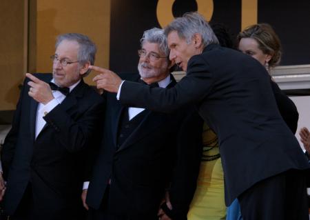 Steven Spielberg, George Lucas and Harrison Ford attending a film festival.
