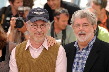 Steven Spielberg smiles next to George Lucas at Cannes.
