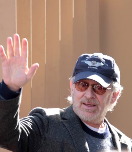 Steven Spielberg waves at his movie premiere
