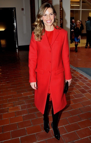 Hilary Swank in red coat