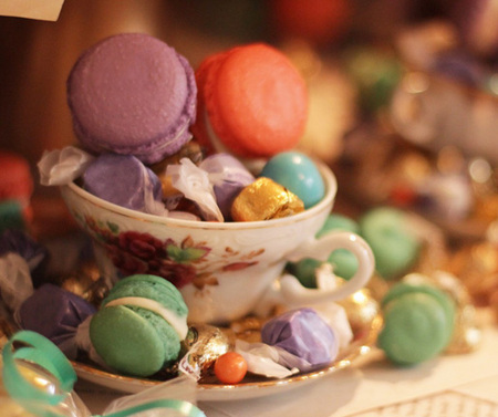 Teacups filled with macarons