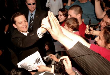 Tobey Maguire signs autographs for his fans