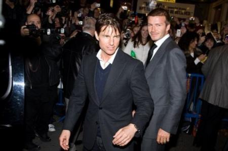 Tom Cruise and David Beckham are greeted by the paparazzi