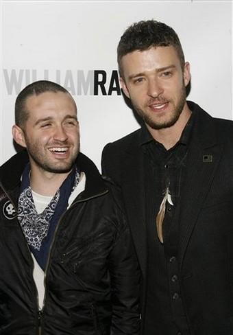 Trace Ayala laughs next to Justin Timberlake at a William Rast publicity event