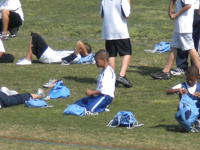 Trey (11 years old) gets ready to run track