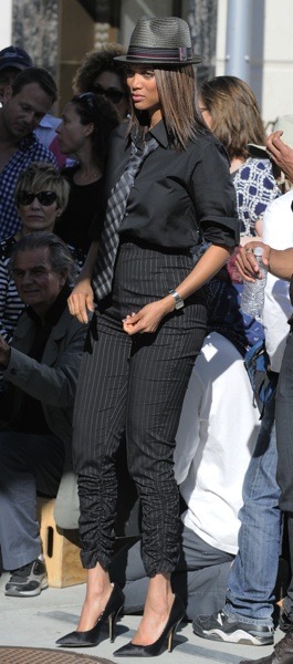 Tyra Banks in pin striped pants