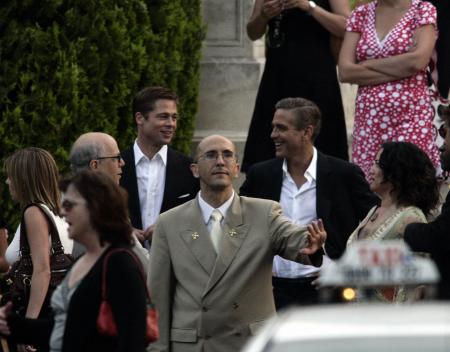 Brad Pitt and George Clooney walking down stairs in Venice
