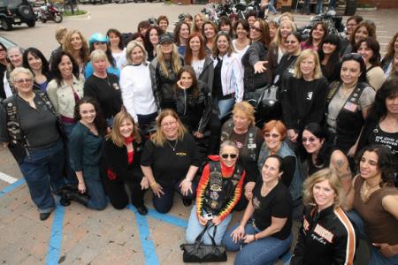 Women riders pose during International Female Ride Day