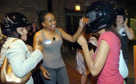 Trying on helmets at a Harley-Davidson Garage Party
