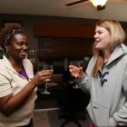 Kelly and Maria toast the finished room