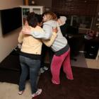Kelly hugs the dseigners