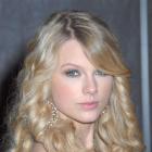 Taylor Swift's Long Curly Hair with Side-Part