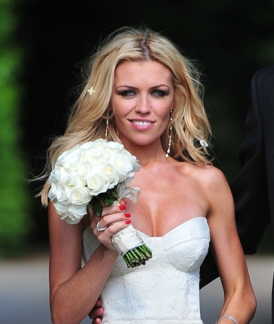 Abbey Clancy wears her blonde hair in waves on her wedding day
