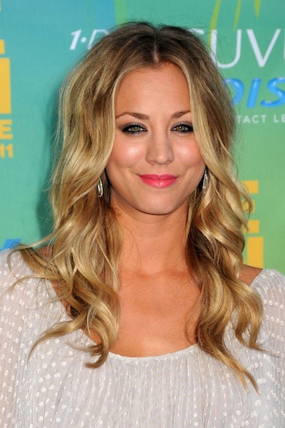 Kaley Cuoco styles her blonde hair with curly waves Photo courtesy WENN