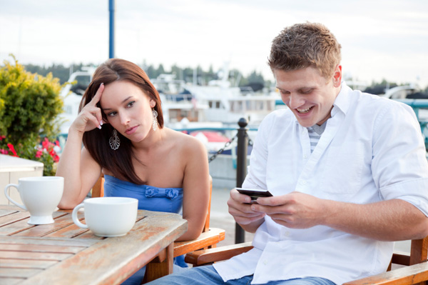 Man texting while on a date