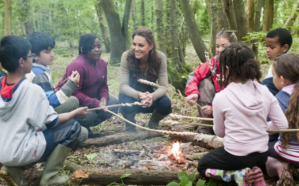 Kate Middleton trades her crown for a campfire