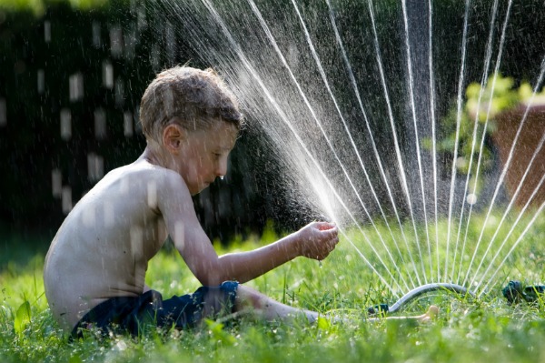 The most glorious summer days were spent playing in the sprinkler ...